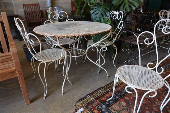 A wrought iron circular garden table and four chairs, table 98cm diameter